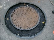 Výšková úprava revizních šachet, oprava komunikace